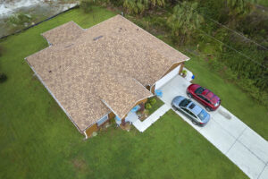 An aerial view of a home with a new shingle roofing system.